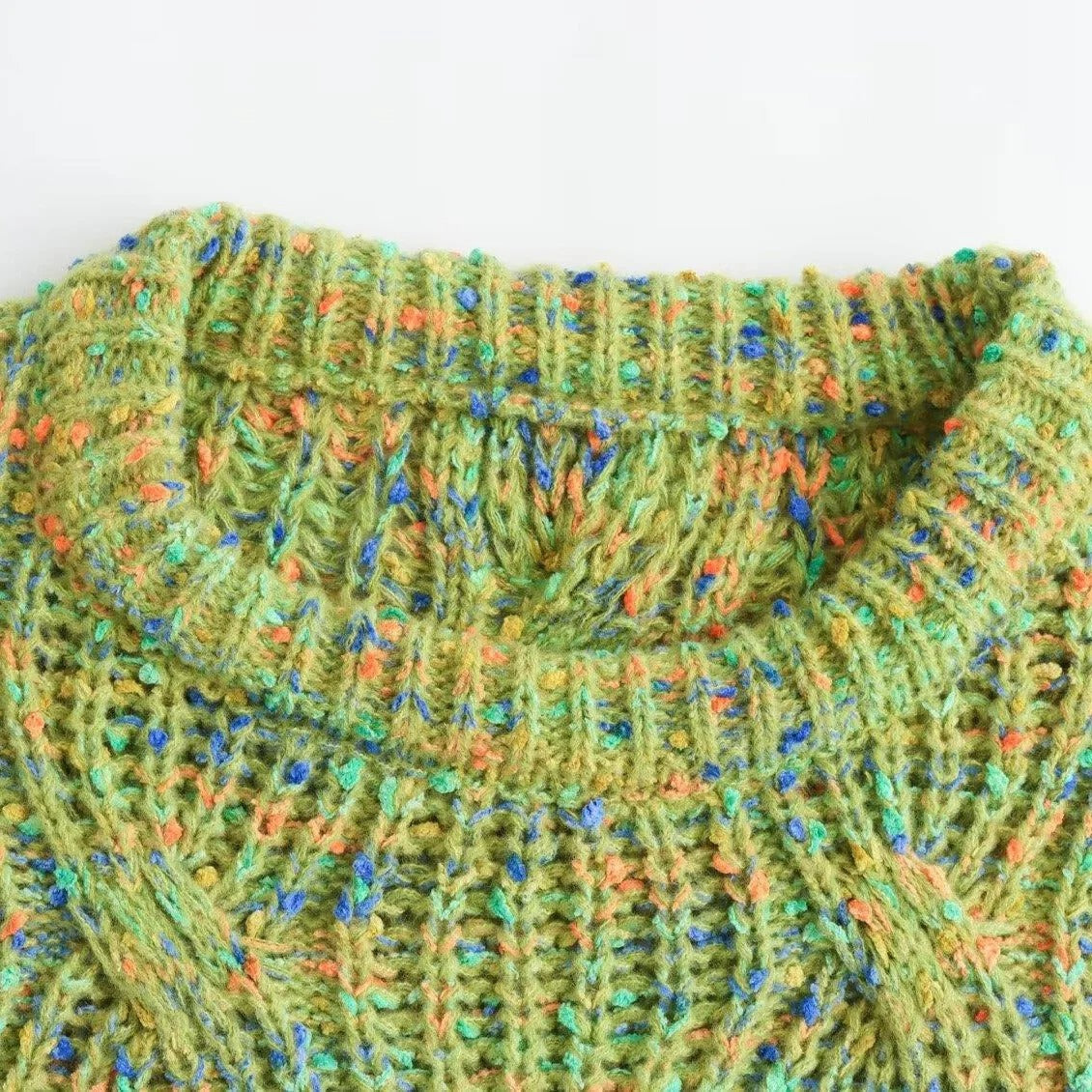 Green cable knit jumper with multicolour fleck detail